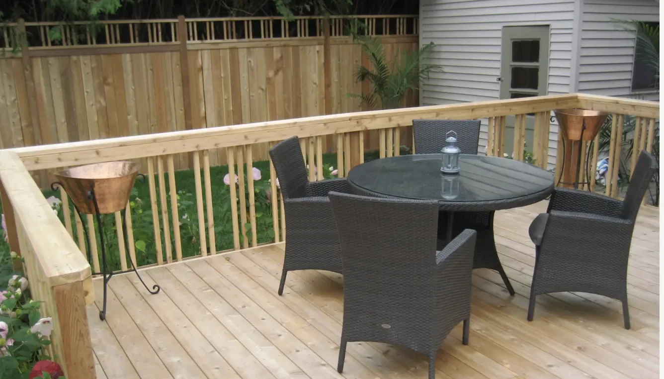 Wood backyard deck with cedar railings and balusters to inspect before deck season.