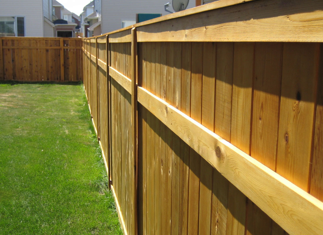 Cedar Fence & Gate installed in Orleans, Ontario by Fence Masters Ottawa — Cedar fence run with a reinforced walk gate and hidden hardware