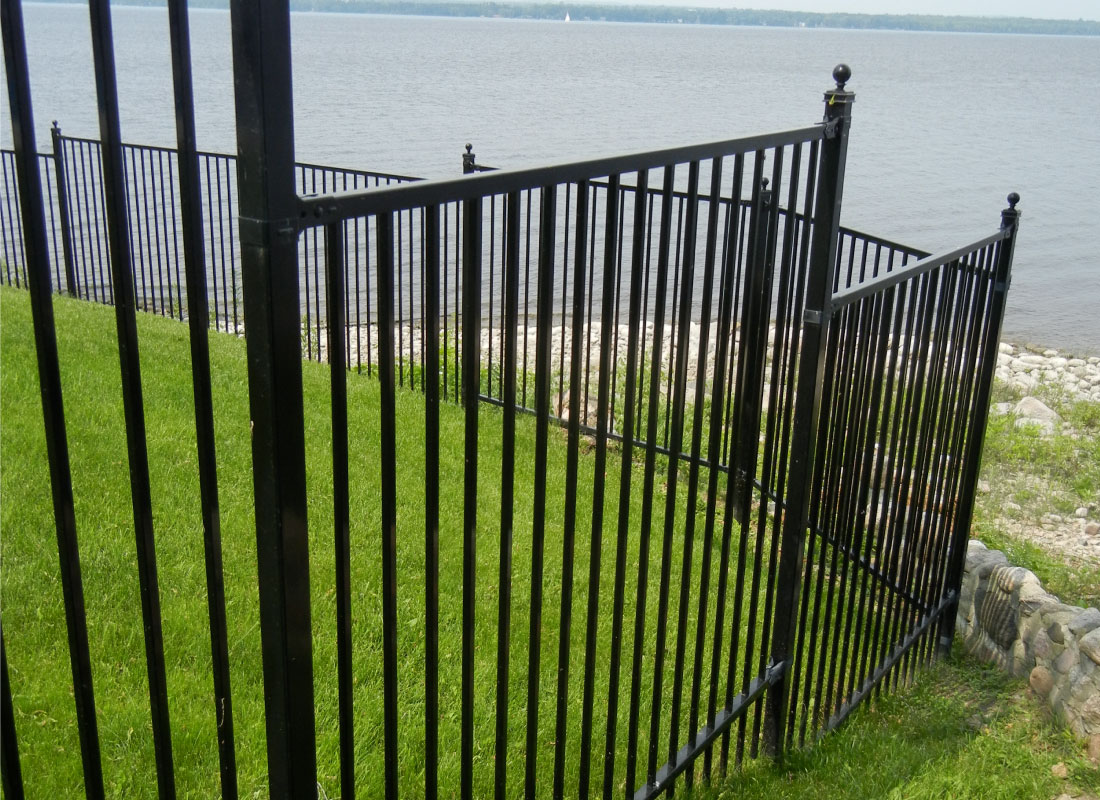 Iron Garden Fence installed in Ottawa, Ontario by Fence Masters Ottawa — Low-profile ornamental iron defining garden beds and walkways