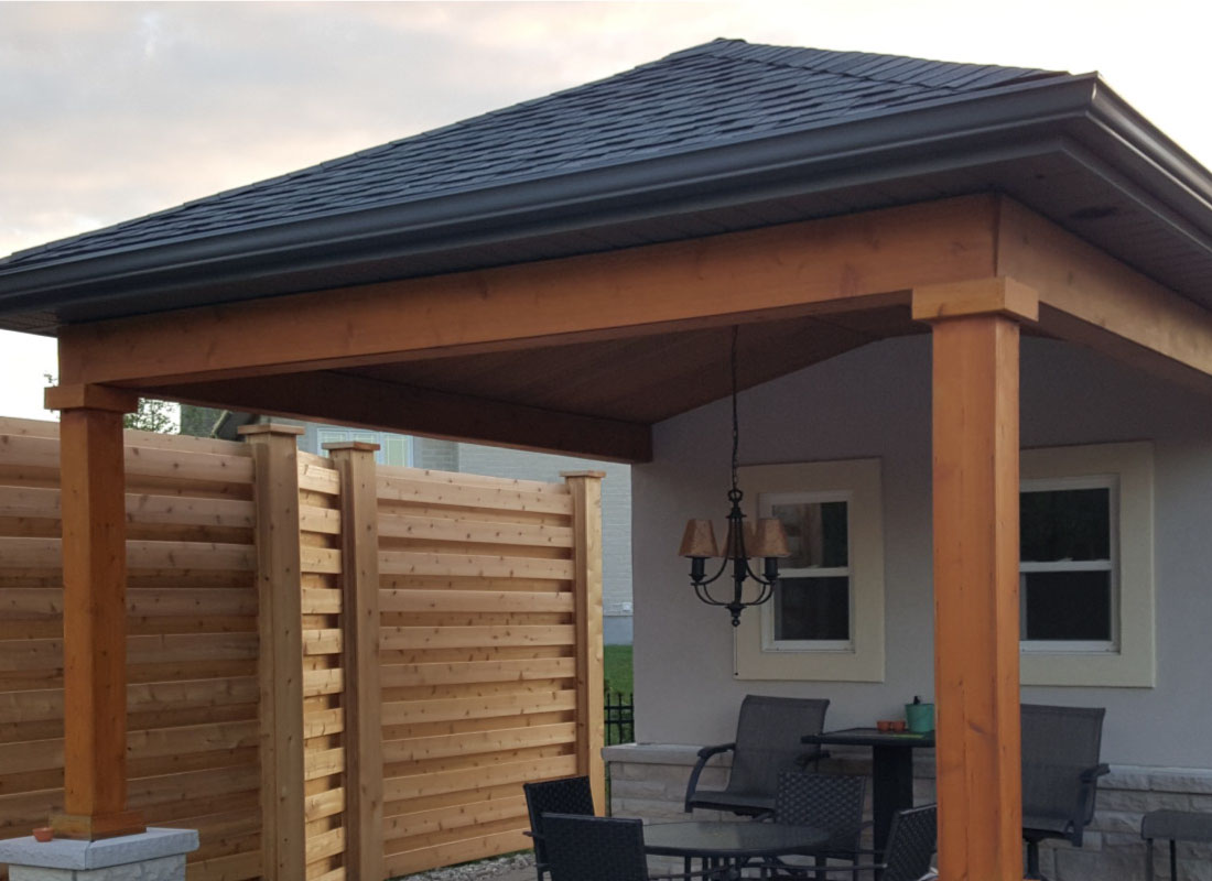 Attached Shade Pergola installed in Kanata, Ontario by Fence Masters Ottawa — Pergola tied into the home's rear wall for shaded dining