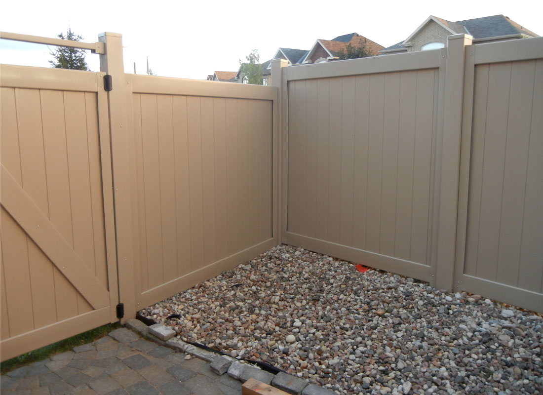 White PVC Privacy Fence installed in Kanata, Ontario by Fence Masters Ottawa — Maintenance-free PVC panels that stay bright season after season