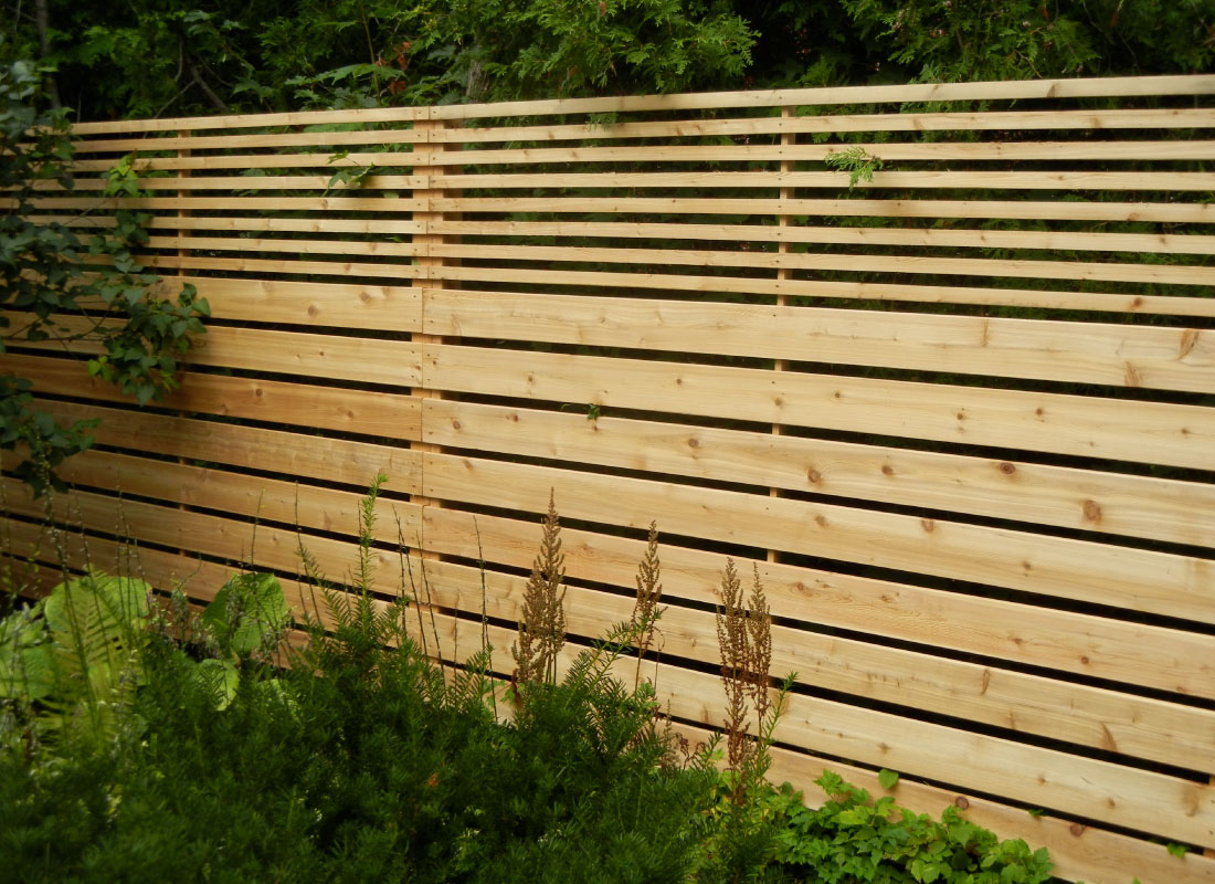 Lattice-Top Wood Fence installed in Ottawa, Ontario by Fence Masters Ottawa — Privacy fence topped with lattice for light, airflow and detail
