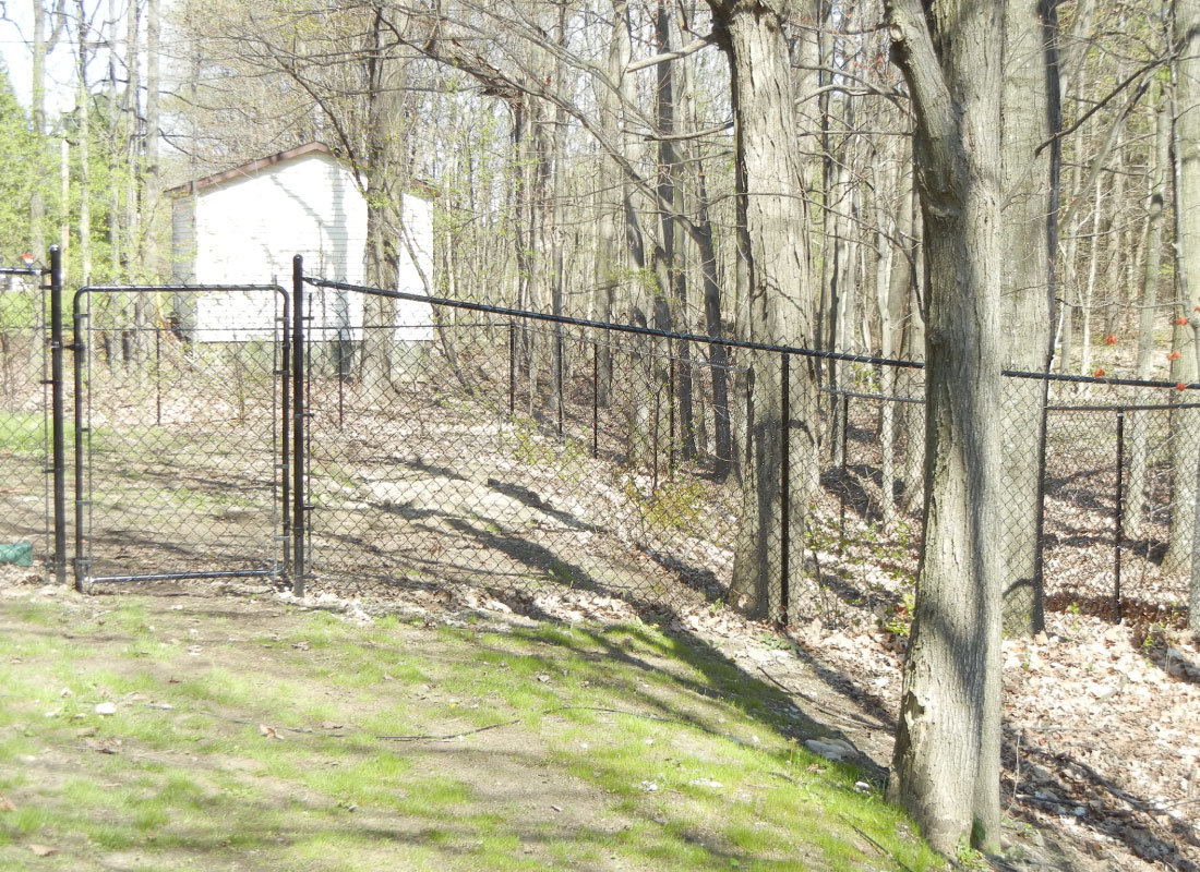 Galvanized Chain Link installed in Gloucester, Ontario by Fence Masters Ottawa — Heavy-gauge galvanized chain link for durable, unobstructed property lines