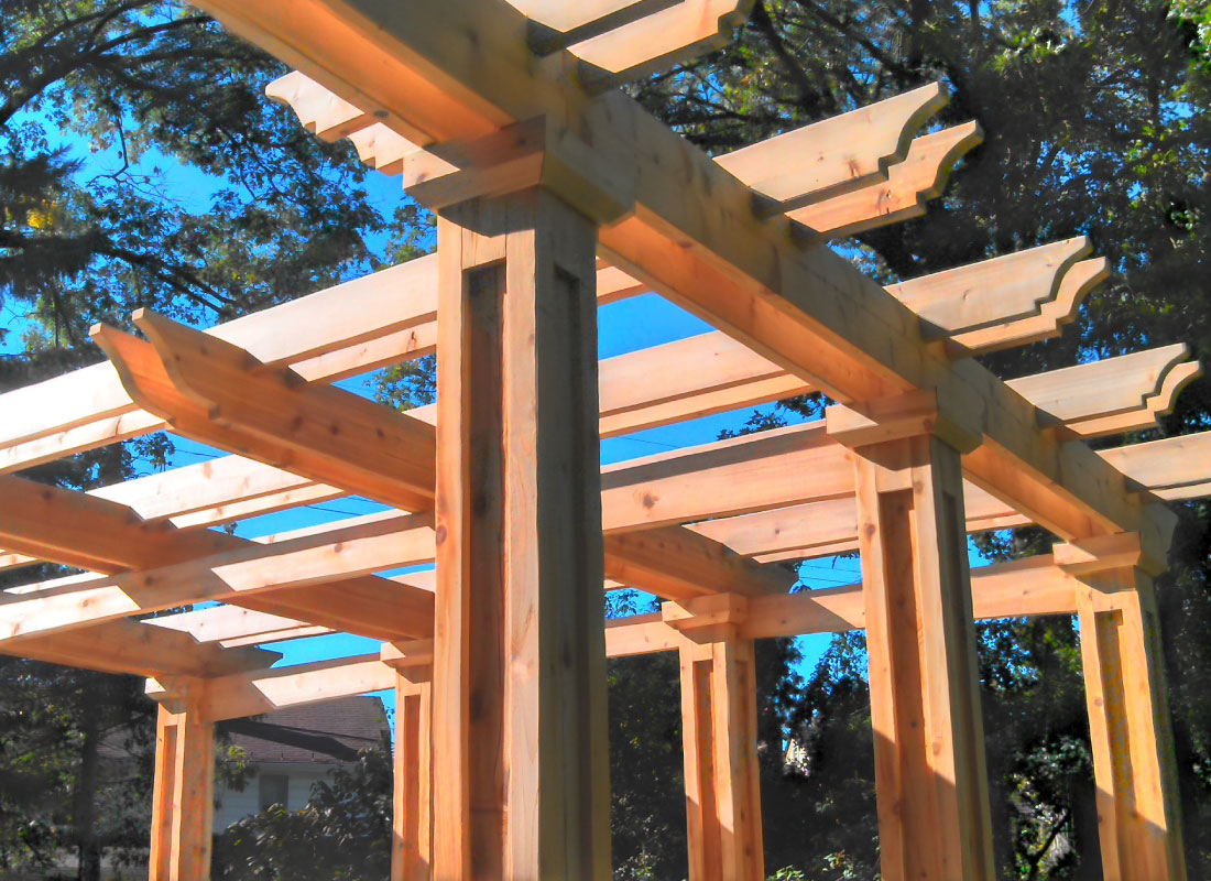 Freestanding Pergola installed in Stittsville, Ontario by Fence Masters Ottawa — Freestanding structure with heavy posts and layered rafter tails
